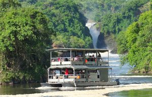 A boat returning tourists from viewing the mighty Murchison falls at Murchison Falls National Park Uganda.