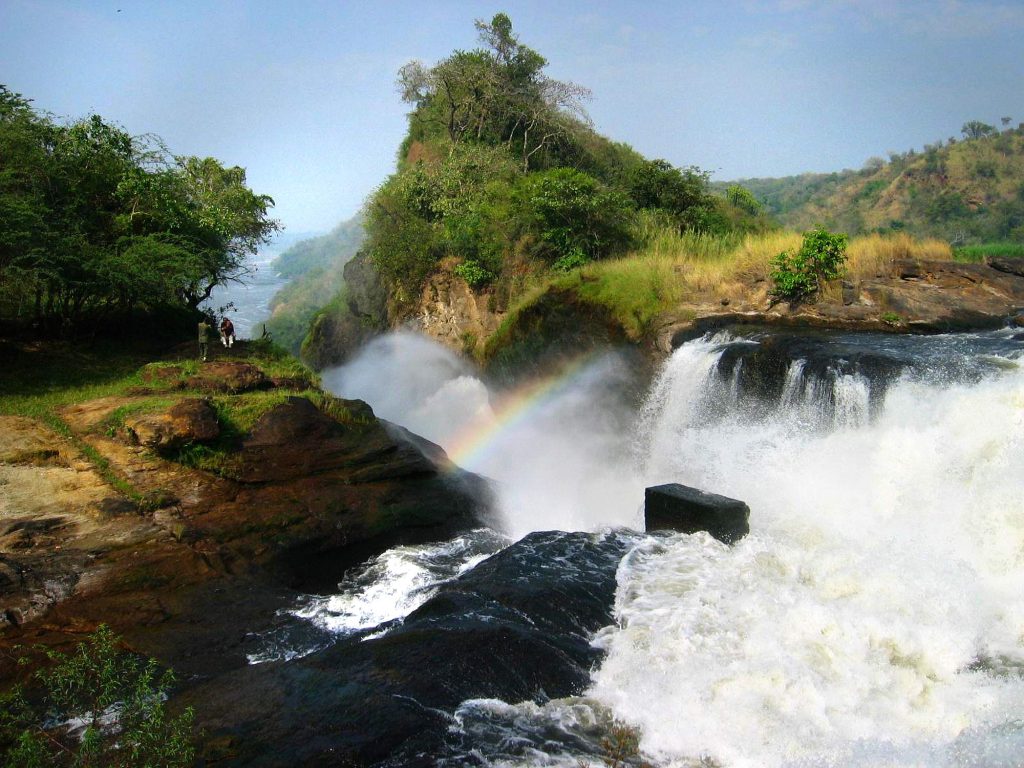 A rain bow gemming within the mist steam at Murchison Mighty water Falls in Murchison falls National Fall Uganda.