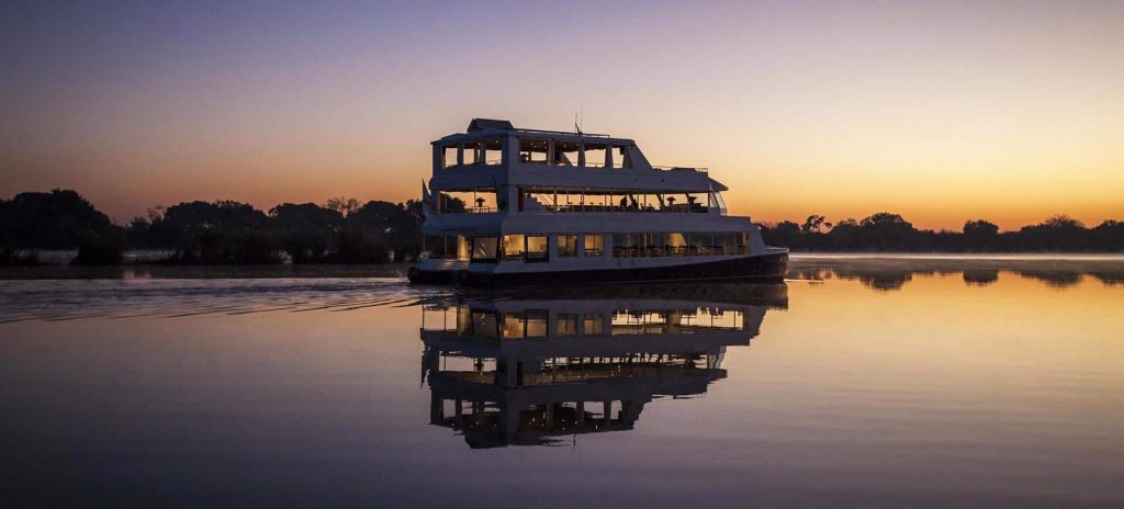 Boat cruise at sun set along Zambezi river Zambia