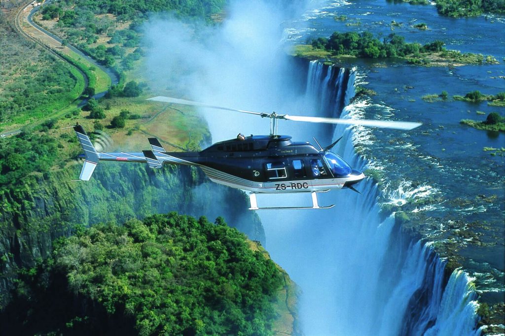 flight-of-angels helicopter over victoria falls Zimbabwe.