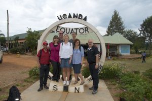 Tourists posing for a photo at Kayabwe equator tour Uganda