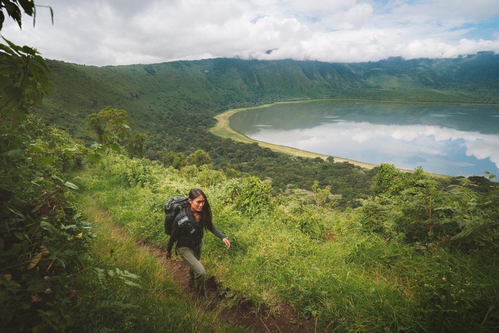 Tourist having a nature walk Ngorongoro crater rim Tanzania.