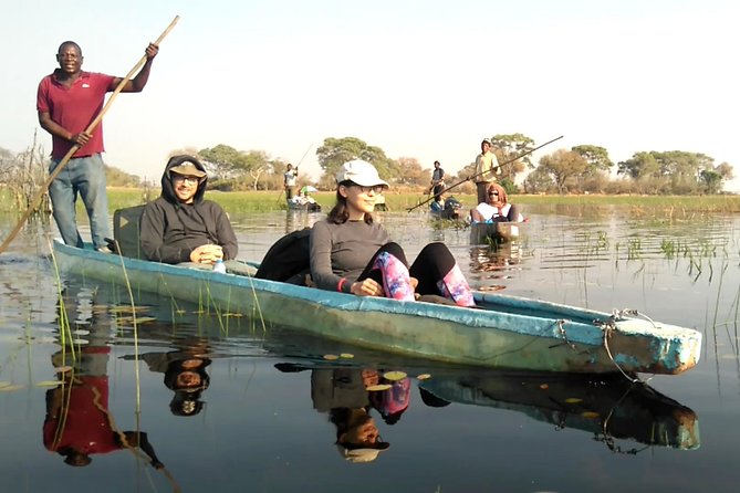tourists game gliding through Okavango delta
