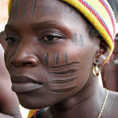 Igbo woman with traditional tribal face masks from south east Nigeria