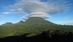 A circular cloud covering one of the 8 volcanic mountains of the Virunga in Rwanda