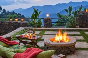 outside honeymoon camp fire with the views of Bwindi impenetrable National Park Uganda Africa