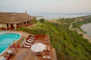 swimming pool at Mweya safari lodge with views of katwe town and kazinga channel Uganda Africa