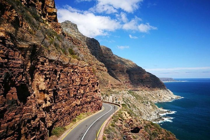 A road meandering along the edge of table mountain cape town