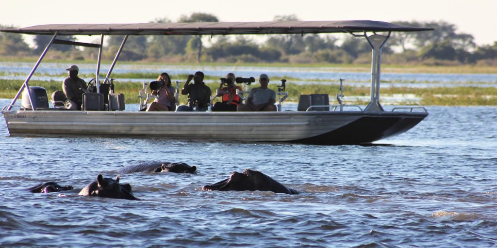 Tourists on boat safari Lake Nakuru national park Kenya