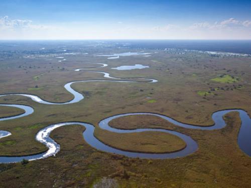 An aerial image of the meandering waterways of the Okavango Delta. Botswana